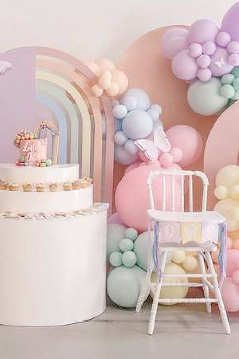 Take a look at this gorgeous pastel rainbow birthday party! The highchair is so cute!! See more party ideas and share yours at CatchMyparty.com Pastel Rainbow One Year Old Party, Pastel Theme First Birthday, Pastel Colour Birthday Theme, Pastels Theme Party, Pastel One Year Old Birthday, Pastel Colors Birthday Theme, Pastel Birthday Ideas, Rainbow One Year Old Party, Pastel Rainbow Balloon Garland