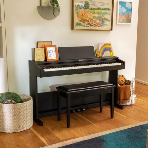 When looking for your family’s first piano, authentic tone and playability should be your top priority. The affordable RP107 delivers on both counts, thanks to the acclaimed sound engine and keyboard action found in higher-end Roland pianos. It looks attractive too, with a smart design that combines traditional styling with a compact footprint that fits in any space. Piano Room Design, Neutral Apartment Decor, Roland Piano, Piano Grand, Piano Desk, Piano Decor, Piano Bench, Piano Room, Flat Interior