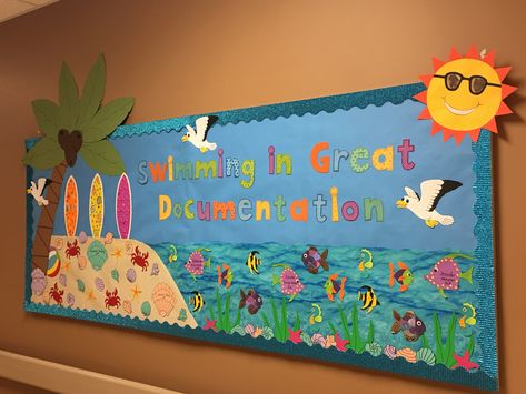 Beach Summer Bulletin Board- June 2018 Beach Themed Bulletin Board Ideas, Beach Theme Bulletin Board Preschool, Beach Bulletin Board Ideas, Bulletin Board Ocean Theme, Ocean Bulletin Board Ideas Sea Theme, Floating Into Summer Bulletin Board, Beach Display Board Nursery, Summer Display Board Nursery, Diving Into Summer Bulletin Board