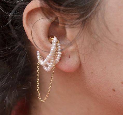 Magnet Ear Cuff Pearl, PEarls Ear Wraps, Magnetic Earrings, hypoallergenic. . #MagnetEarCuff #PearlEarWrap #MagneticEarrings #HypoallergenicJewelry #PearlAccessories #EarCuffStyle #ElegantEarrings #PearlPerfection #FashionJewels #EarCuffInspo #NoPiercingRequired #ChicAndTrendy #DelicateJewelry #ModernElegance #JewelryLovers #StatementEarCuff #MinimalistJewelry #PearlLove #TrendyEarrings #JewelryInspo #LuxuryJewels #ComfortAndStyle #EarCuffGoals #PearlEssentials #UniqueJewelry #pearlwraps #c... Ear Climber Earrings Gold, Ear Wraps, Earring Cuff, Ear Climbers Earrings, Punk Earrings, Earrings Hypoallergenic, Conch Earring, Pearl Accessories, Magnetic Earrings