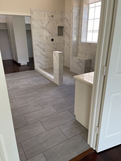 Finishes 12x24 tile style Neopolis laid on 1/3 offset brick pattern color Grey Bathroom Tile 12x24, 24x12 Tile Pattern, 12x24 Bathroom Tile, Large Bathroom Floor Tile Ideas, Big Tile Bathroom, 12x24 Tile Patterns, Dark Floor Bathroom, Mound House, Brick Pattern Tile