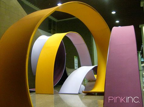 Giant 'ribbon' sculpture Ribbon Installation Art, Ribbon Installation, Interactive Architecture, Ribbon Candy, Ribbon Sculpture, Candy Art, Exhibition Booth, Ribbon Art, Scenic Design