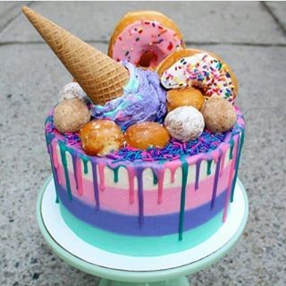 🌟💜 How vibrant is this ice cream cone cake topped with actual donuts? 😻 I found this on @thosesweetdays - they share gorgeous cakes so check them out! 🍦🍩🍰🍨🍭🍧 - Visit www.donutexplorers.com for more!  -  -  -  -  #cakes #cake #icecream #icecreamcake #icecreamcone #icecreamconecake #icecreamlover #icecreamcakes #icecreamday #stripedcake #buttercream #buttercreamcake #dripcake #dripcakes #cakesofig #cakesofinsta #summerfood #summercake #summervibes☀️ #donut #doughnut #doughnuts #donuts #su Ice Cream Cone Cake, Donut Ice Cream, Colorful Cake, Smash Cakes, Colorful Food, Simple Birthday Cake, Easy Cake Decorating, Donut Party, Crazy Cakes