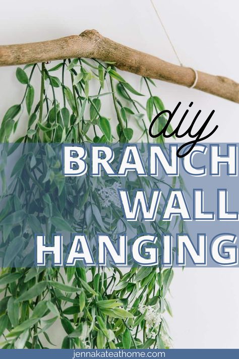 This simple wall hanging idea with a branch and greenery is the perfect way to add a touch of color to any room in your home. Plus, it's incredibly easy to make! Tree Branch Hanging Decor, How To Hang A Branch On The Wall, Tree Branch Diy Projects, Greenery Around Mirror, Greenery Above Bed, Greenery On Wall, Hanging Branch Decor, Grad Banquet, Branch Wall Hanging