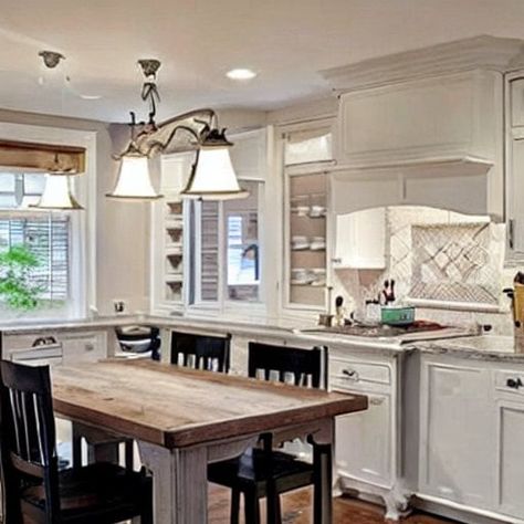 What Color Kitchen Table Should You Pair with White Cabinets? - DreamyHomeStyle Kitchen Table In White Kitchen, White Kitchen Cabinet Dining Table, Classic White Kitchen Table, White Brown Kitchen Table, Brown Wood Table White Chairs, White Kitchen White Countertops Dark Floors Barstools, White Kitchen Table, White Cupboards, Dark Table