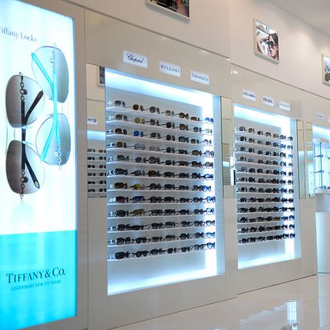 sunglass shop display racks Eyewear Shop Design, Apple Store Design, Sunglass Display, Eyewear Store Design, Eyewear Display, Sunglasses Display, Wall Displays, Sunglasses Store, Showroom Interior Design