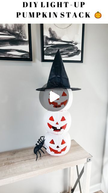 Lisa Marie l Holiday DIYs + Easy Recipes on Instagram: "✨DIY Light-Up Pumpkin Stack 🎃🎃🎃 So simple and such a great Halloween vibe at night when it’s all lit up!! ✨  What you need: * 3 plastic pumpkins * box cutter * fairy lights  * spray paint  * witch hat   How to make it: * use a box cutter to cut out the features of the pumpkin pails.. it slides through the plastic very easily!  * spray paint the pumpkins any color you like.  * hot glue them one on top of the other.  * toss in some fairy lights and top with a witch hat. Enjoy looking at your diy pumpkin stack all season!! 🎃  video description: this is a video of me making a Halloween decoration using plastic pumpkins.   #diyhalloween #halloweendecor #halloween2024 #halloweendecorations #pumpkins #spookyszn" Halloween Stacked Pumpkins Diy, Stacked Plastic Pumpkins Diy, Diy Stackable Pumpkins, Stacked Pumpkins Painting, Pumpkin Pail Crafts, Stacked Pumpkins Diy, Diy Stacked Pumpkins, 3 Pumpkins Stacked, Stacked Halloween Pumpkins