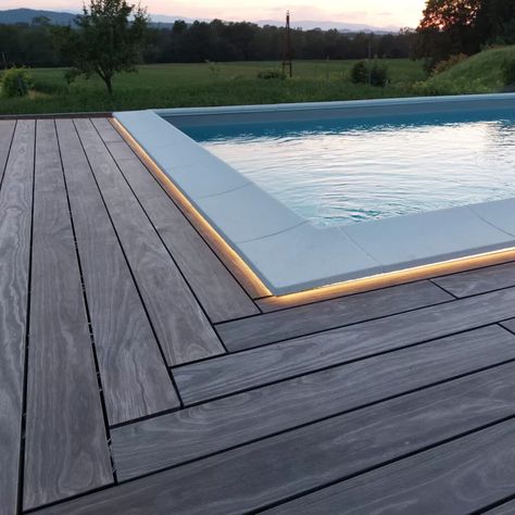 Accoya Color pool decking with LED lighting - Accoya Acetylated Wood | High performance, long life modified wood project case study Pool With Wood Around, Wood Around Pool, Pool With Wood Deck, Wooden Pool Deck, Wood Pool Deck, Decks Around Pools, Pool Decking, Deck Colors, Small Pool Design