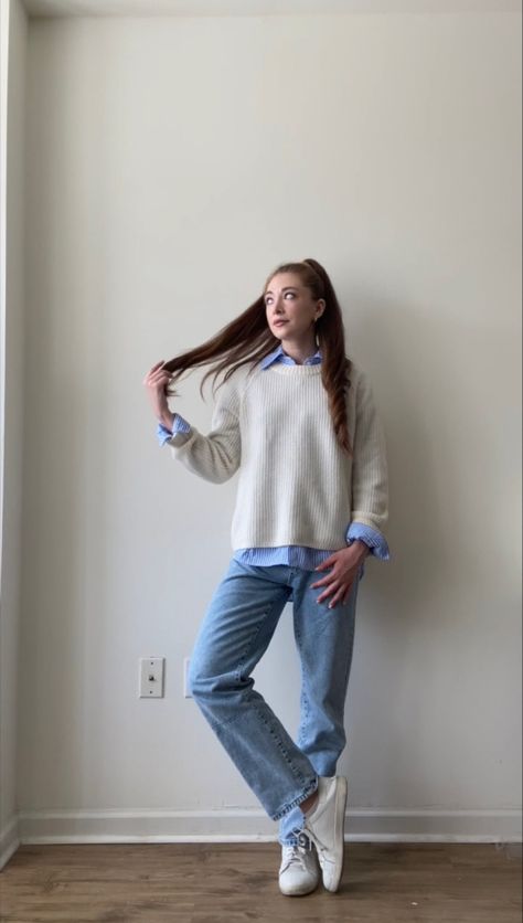 Casual Fall Outfit Inspo For School 📚🍂 This includes a blue & white striped blouse, baggy mom jeans, cream colored cashmere sweater, and white sneakers. Cute, comfy, & casual. Blue Shirt And Sweater Outfit, Blue And White Winter Outfit, Light Blue Sweater Outfit, Blue And White Striped Shirt Outfit, Striped Blouse Outfit, Blue Outfit Winter, Montreal Winter, Basic White Blouse, Blue Striped Shirt Outfit