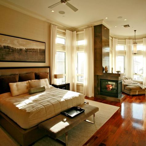 Check out this contemporary master bedroom with cherry wood floors and a cozy reading nook on HGTV.com. Neutral Bed, Neutral Bed Linen, Cherry Wood Floors, Small Fireplace, Brown Floors, Bedroom Images, Brown Bedroom, Fireplace Surround, Brown Stone