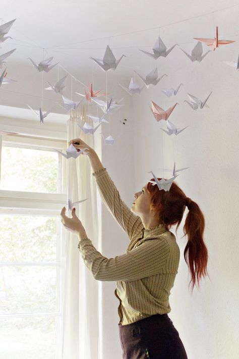 DIY | Renters-Friendly Origami Ceiling Decoration Diy Origami Decor, Diy Origami Home, Diy Origami Home Decor, Perlengkapan Bayi Diy, Origami Decor, Origami Home Decor, Origami Swan, Origami Ball, Origami Decoration