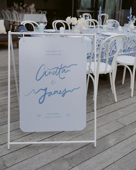 Jem&I Designs on Instagram: "Welcome sign from our new Vacay Semi-Custom Collection with rounded corner details in a gorgeous soft blue colour palette. 💙 Stay tuned to see more from this gorgeous photoshoot we did with @cultivate.andcreate in Queenstown. Host and image @katerobergephotography Host @ashleighhaasephotography Workshop @cultivate.andcreate Venue @eichardts Styling @hollyandcoevents Stationery @jemandi_designs #jemandi #weddingstationery #weddinginvitations #savethedate #wed Blue And White Wedding Signage, Blue Wedding Signage, Wedding Welcome Sign Blue, Gorgeous Photoshoot, Handwritten Wedding Invitations, 2026 Wedding, Handwritten Wedding, Event Branding, Coastal Wedding