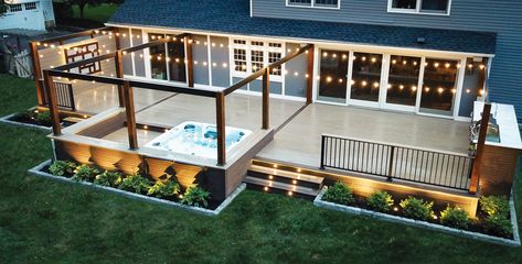 Simple details were included in the design of this contemporary deck to improve access to its hot tub and outdoor kitchen. Hot Tub And Outdoor Kitchen, Deck With Hot Tub, Deck Skirting Ideas, Swim Spa Landscaping, Wooden Deck Designs, Skirting Ideas, Trek Deck, Spa Landscaping, Deck Skirting