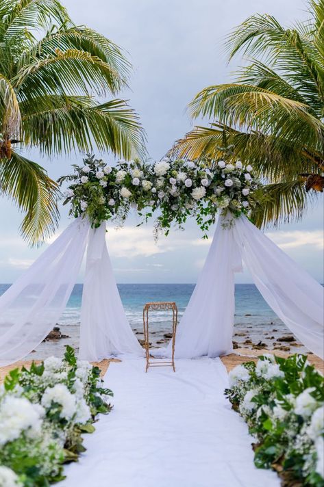 Wedding arch at the beach #wedding #destinationwedding #weddingtip #bridetip #cruisewedding #beachwedding #eventplanner #weddingplanner #weddingdress #marryinroatan #roatan #honduras #beach #destinationweddingtips #weddingdetail #weddingday #weddingvenue #weddingceremony #beachweddingideas #bridalflowers #sunsetwedding #weddingdress #weddingdecor #weddingideas #weddingphotography #modernwedding #luxurywedding Wedding Arch Ideas Beach, Beach Wedding Photobooth, Elegant Beach Wedding Ceremony, Wedding Backdrop Beach, Beach Wedding Arch Ideas, Wedding Environment, Green Beach Wedding, Honduras Beach, Beach Wedding Ceremony Arch