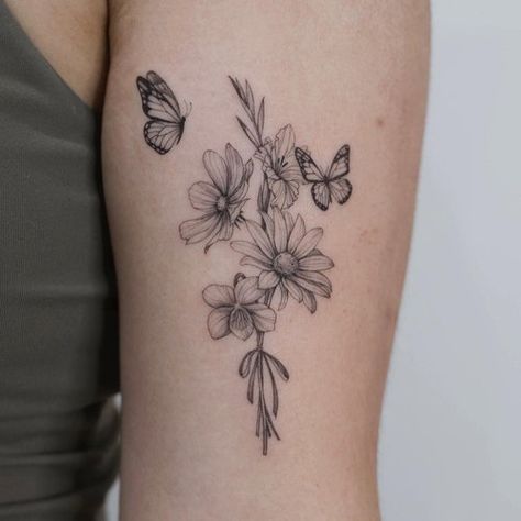 Violet Flower With Butterfly Tattoo, Butterfly Bouquet Tattoo, Marigold Butterfly Tattoo, Daisy And Violet Tattoo, Tattoo Wrist Flower, Behind The Arm Tattoo Women, Upper Sleeve Tattoo Women, Flower And Butterfly Tattoo, Butterfly With Flowers Tattoo