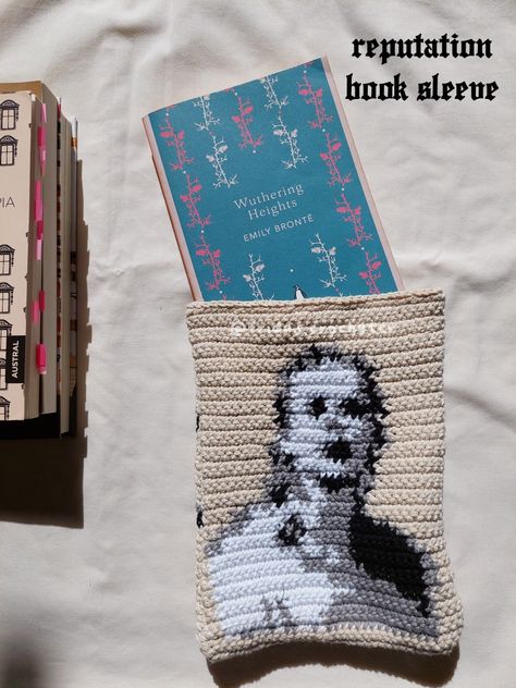 Crochet book sleeve - taylor swift inspired Taylor Swift Crochet Graph, Knit Book Sleeve, Boygenius Crochet, Taylor Swift Tapestry Crochet, Taylor Swift Knit, Taylor Swift Crochet Ideas, Taylor Swift Crochet Pattern, Taylor Swift Alpha Pattern, Taylor Swift Inspired Crochet