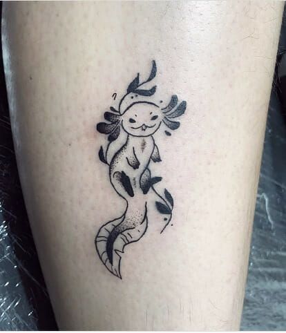 51 Axolotl Tattoos- Celebrating the Enigmatic Mexican Salamander - Psycho Tats Small Axolotl Tattoo, Axolotl Tattoo Simple, Black Work Bat Tattoo, Axotl Tattoo, Axolotl Tattoo Ideas, Axolotl Tattoo Design, Cuttlefish Tattoo, Nomad Tattoo, Salamander Tattoo