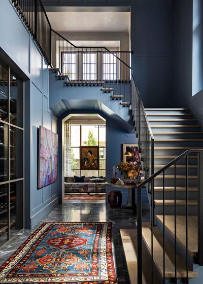 A New Build in Houston Features Fresh Color and Materials Rooted in the Past Minimalist Bedroom Lighting, Black Marble Floor, Marble House, Modern Minimalist Bedroom, Glass Front Cabinets, Painted Stairs, Marble Backsplash, Blue Cabinets, Wine Room