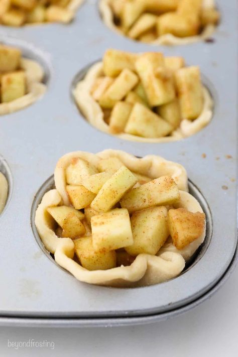 For such a cute bite-sized pie, these Mini Apple Pies are jam-packed with flavor! They’re easy to make and baked in a muffin tin. I topped with a simple yet mouthwatering crumble topping. Mini Muffin Apple Pie Bites, Apple Pie Mini Cups, Cupcake Pan Apple Pie, Apple Pies In Cupcake Pan, Apple Pie In Ramekins, Apple Pie In Muffin Cups, Apple Pie In Cupcake Tins, Apple Pie Tarts Easy, Individual Apple Pies Muffin Tins