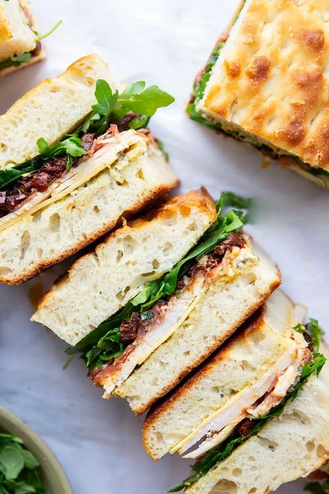 Layers of roast turkey, cheese, and flavorful sundried tomatoes star in this turkey focaccia sandwich that's so easy to whip up and perfect for leftover turkey! Roast Turkey Sandwich Recipes, Turkey Cheddar Sandwich, Turkey Melt Sandwich, Turkey And Cheese Sandwich, Focaccia Sandwich, Turkey Melt, Turkey Sandwich, Turkey Cheese, Sundried Tomatoes