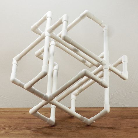 PVC Art, I think once the adult cut the different length of pipe, kids can have fun putting it together. Pvc Pipe Art, Pvc Art, Pvc Pipe Crafts, Pvc Pipe Projects, Pvc Projects, Hanging Display, Geometric Sculpture, Pipe Furniture, White Chrome