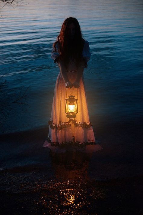 Girl holding a lantern standing in water at night Fantasy Magic, Fantasy Photography, Beltane, Foto Art, Disney Films, Story Inspiration, 인물 사진, 그림 그리기, The Ocean