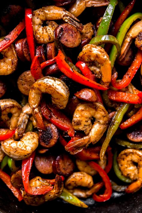 Cajun Stir Fry | KJ & Company - a vibrant twist on a favorite weeknight meal! Classic stir fry takes a vacation when shrimp are tossed in cajun seasoning and seared with cajun-style smoked sausage. Toss in some sliced bell peppers and sauté to perfection. You only need a handful of ingredients for a delicious, flavor-packed dinner! Get the recipe on https://kjandcompany.co #recipe #dinner #easydinner #weeknightmeal #stirfry #shrimp #cajun #easydinnerideas #glutenfree #recipeideas Smoked Sausage Stir Fry Recipe, Sausage And Shrimp Recipes, Sausage Stir Fry, Stir Fry Shrimp Recipes, Cajun Shrimp Recipes, Smoked Sausage Recipes, Steak And Shrimp, Sausage Dishes, Pork Stir Fry