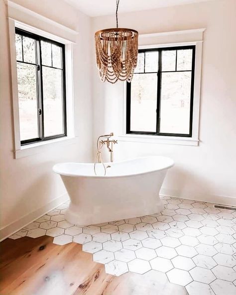 World Market on Instagram: “Bathroom goals! Our Whitewash Wood Draped Bead 4 Light Chandelier looks stunning in this space by @rippyhomes. (Shop all available products…” Beaded Chandelier Bathroom, Bathroom Chandelier Over Tub, Bathtub Chandelier, Chandelier Over Tub, Modern Bathroom Tile Ideas, Bonnie Ryan, Pottery Barn Chandelier, Modern Farmhouse Bathroom Ideas, Bathroom Chandelier