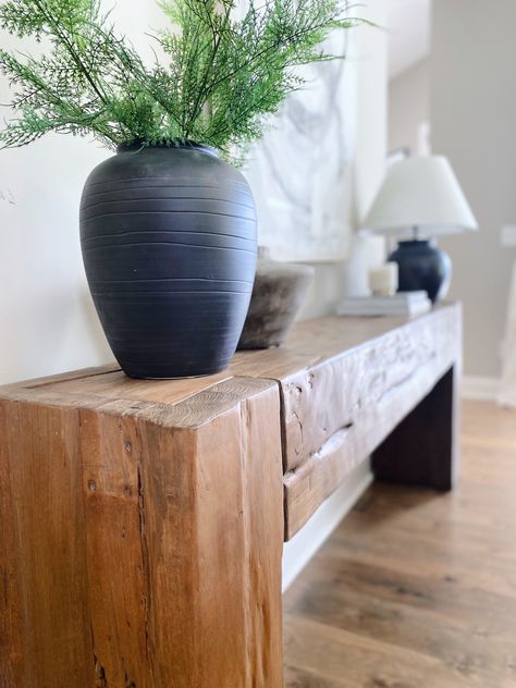 Wood console table decor. Rustic vases. Greenery. Candles. Coffee table books. Console decor. Rustic lamp. Target lamp. Arhaus. Studio McGee. Amber Interiors. Living room inspiration. Neutral home inspiration. Instagram home reels. Midwest homes. Ohio homes. Custom homes. Pottery Barn. Canvas art. Console. Shelf styling. Interior inspiration. Styling inspiration. Neutrals. Wood. Natural. Ubud console table. Ubud Console, Lake Life, Ubud, My Happy Place, Happy Place, Happy Places, Entryway, Lake, Furniture