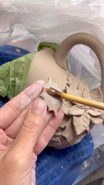 Spriggin Awesome Studios on Instagram: "A poinsettia and holly mug made with our Holly & Berries molds! All of the petals and leaves on this piece have added supports behind them so this mug will not be fragile. People don’t buy fragile cups! I make my mugs to be used. Daily if you so choose. ✨🌺🔔🌺✨" Ceramics Videos, Christmas Leaves, Clay Christmas, Pottery Techniques, Holly Berries, Holly Leaf, Pottery Mugs, Christmas Mugs, Poinsettia