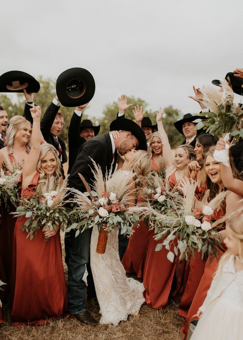 Western boho wedding party photo inspo - cowboy groomsmen and terracotta bridesmaid dresses from Azazie Fall Western Wedding Bridesmaid Dress, Western Boho Wedding Bridesmaid Dress, Wedding Party Photos Country, Bridesmaid Dresses Country Wedding, Western Wedding Couple Poses, Western September Wedding, Cowboy Bridesmaid Dresses, Western Bridesmaids Dresses, Country Wedding Party Attire