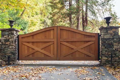 Gorgeous cedar wood farmhouse design driveway gate with custom stone posts and matching stone wall. Amazing curb appeal, not to mention added privacy and security with this gate! Designed and installed by Tri State Gate in Bedford Hills, New York. Gates For Houses, Wood Driveway, Wooden Gate Designs, Entrance Landscaping, Aluminum Driveway Gates, Wood Gates Driveway, Contemporary Gates, Tor Design, Gates Driveway