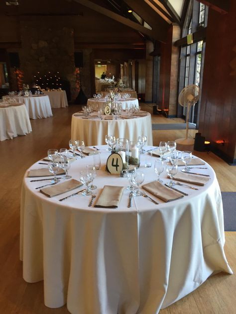 Beige linens and khaki napkins. White Tablecloth Champagne Napkins, White Table Cloth Tan Napkin Wedding, Khaki Table Linens Wedding, Taupe Napkins Wedding, Ivory Linens Wedding Table, Beige Napkins Wedding, Brown Chairs Wedding, Wedding Reception Table Linens, Linen Tablecloth Wedding