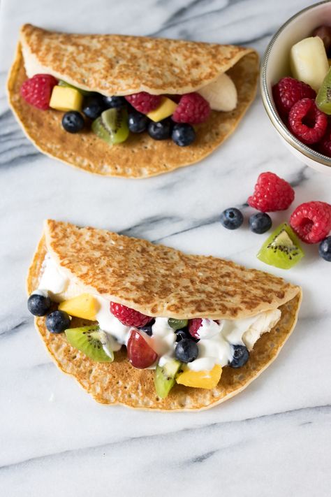 Fruit tacos are a fun, but healthy, dessert for kids and grown ups. The fruit filled crepes are quick, easy and endlessly customisable. Tacos For Kids, Fruit Tacos, Fruit Taco, Filled Crepes, Dessert For Kids, Fruit Recipes For Kids, Veggie Desserts, Healthy Desserts For Kids, Kid Friendly Dessert