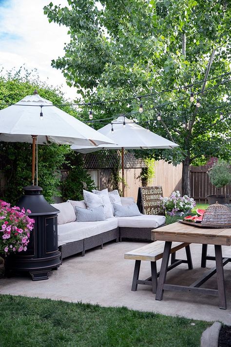 This small patio layout shows that a patio doesn't have to be large to be functional, fitting a table, sectional, outdoor fireplace, and potted plants, this space is perfectly suited for our family of 6. Small Patio Design, Backyard Ideas For Small Yards, Patio Layout, Cheap Backyard, Small Backyard Ideas, Summer Backyard, Summer Patio, Small Yard, Small Backyard Patio