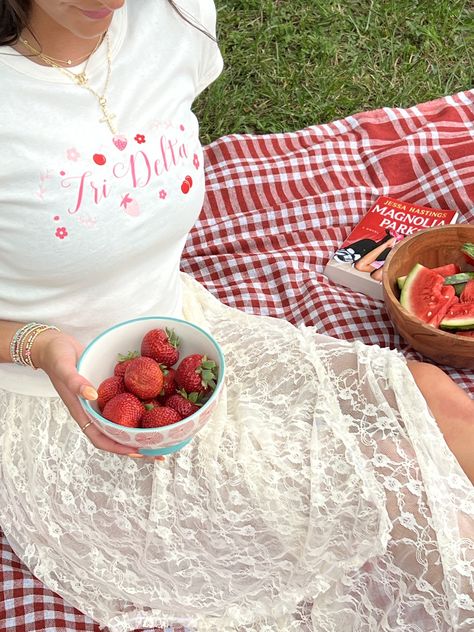 Berry cute 🍓 Message us to start your order today!! #bidday #sorority #outfitinspo #recruitment #picnic #tridelt #tridelta sorority merch, sorority designs, greek life, picnic, college, bid day, outfit inspo, tri delta, red, recruitment, baby tee Valentine Photoshoot, Sisterhood Events, Red Picnic, Sorority Themes, Tri Delt, College Event, Alpha Gam, Retreat Ideas, Sorority Merch