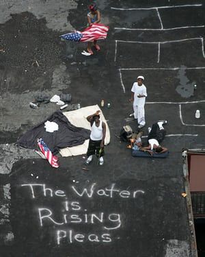 New Orleans residents wait on a rooftop to be rescued after Hurricane Katrina in 2005. Government Budget, Naomi Klein, Extreme Weather Events, Today In History, After The Storm, Extreme Weather, Bbc News, Natural Disasters, The Guardian