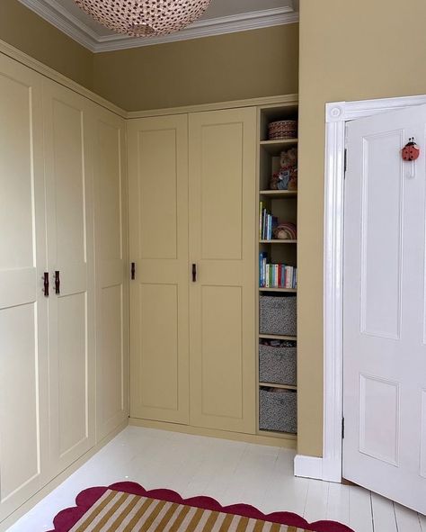 Farrow & Ball Hay No.37 is a dusty, modest yellow that has a distinctly green undertone which gives it an established feel, creating peaceful spaces. We think it fulfilled its obligation in this lovely nursery, don’t you? Walls and wardrobe painted in Hay Dead Flat. 📸: @joannalari Repost: @farrowandball Sample pots available at Hirshfield’s Edina and Roseville locations. Hay Farrow And Ball Bedroom, Ball Green Farrow And Ball, Hay Farrow And Ball, Templeton Pink Farrow And Ball Bedroom, Farrow And Ball Templeton Pink, Dayroom Yellow Farrow And Ball, Farrow And Ball Closet Stripe Wallpaper, Farrow And Ball Pink Drab, London Flat Interior