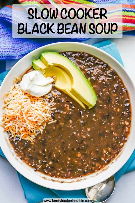 Slow cooker black bean soup is a delicious, hands-off vegetarian soup that’s hearty and filling for a chilly day. Add your favorite toppings and grab a spoon! Black Bean Soup Crock Pot, Slow Cooker Black Bean Soup, Bean Soup Crockpot, Slow Cooker Black Beans, Black Bean Soup Recipe, Healthy Slice, Dried Black Beans, Crockpot Dinners, Bean Soup Recipes