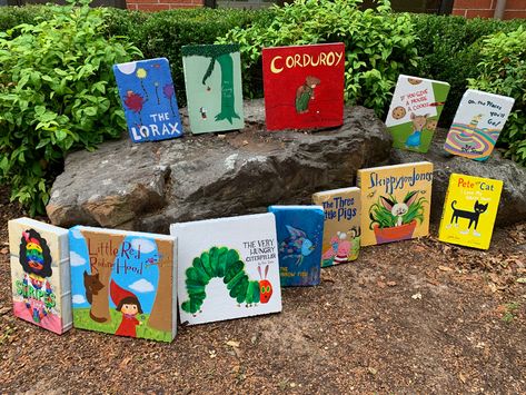 My students painted concrete pavers to look like popular childrens books. Brick Book Painting, Painted Bricks For Garden, Bricks Painted Like Books, Book Pavers, Book Bricks, Brick Book, Garden Bricks, School Courtyard, Brick Books