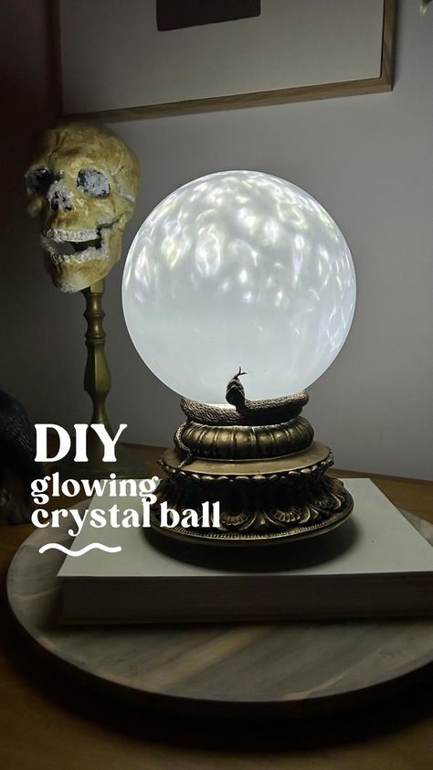 25K views · 2.6K reactions | Project 7 from my Halloween DIY Series and we’re making a Glowing Crystal Ball 🔮 You’ll need: • A base (mine was a thrifted candle pillar, but you can also use a bowl that has been flipped over with the base cut out) • A starlight projector (mine was $29 @kmartaus) • A batten light fitting (you can thrift these or buy from a hardware store for under $20) Optional: • Epoxy glue to glue the lampshade to the base (not necessary but handy to secure it) • Apoxie Scu Rub N Buff Antique Gold, Starlight Projector, Glowing Crystal, Apoxie Sculpt, Halloween Potion Bottles, Rub N Buff, Halloween Bedroom, Halloween Ball, Halloween Witch Decorations