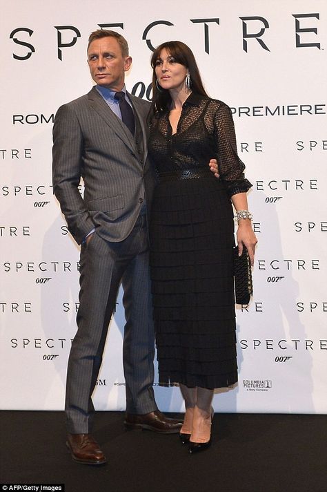 So chic: A pair of patent black heels and a clutch bag finished off Monica's ensemble, whi... Monica Belluci Spectre, Monica Belluci Older, The Raffle Monica Bellucci, James Bond Outfits, Belluci Monica 2022, Bond Outfits, Monica Belluci In La Riffa, Sheer Black Shirt, Black Patent Heels