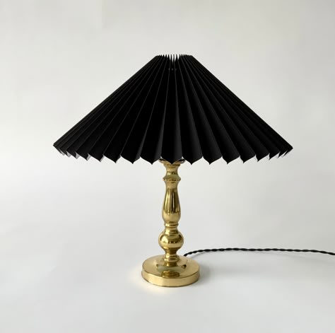 "A classic Danish, 1970's vintage brass table lamp with a new black chintz, pleated linen lampshade, and new black twisted fabric cable, with integral on/off switch. The lamp is in very good vintage condition with just a few minor dark age related spots and general patina. In perfect working. Height lamp without shade: 26 cm, 10 1/4\" Height lamp with shade: 35 cm, 13 3/4\" Diameter base: 10 cm, 4\" Side length lampshade: 21 cm, 8 1/4\" Light fitting: Edison E26/27" Vintage Eclectic Home, Pleated Lampshade, Twisted Fabric, Linen Lampshade, Brass Table Lamp, Base 10, Table Lamps For Bedroom, Brass Table, Brass Table Lamps