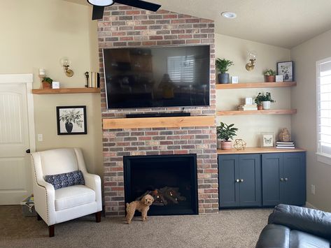 Thin brick fireplace with a slanted vaulted ceiling. Slanted Fireplace Living Room, Living Room With Slanted Ceiling, Fireplace With Slanted Ceiling, Fireplace Slanted Ceiling, Slanted Ceiling Living Room, Room With Slanted Ceiling, Angled Ceiling, Slanted Ceiling, Room Remodel