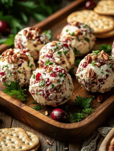 Looking for a show-stopping appetizer that is as delicious as it is beautiful? Cranberry Pecan Cheese Balls are the perfect addition to your next party or family gathering! Creamy, tangy, and nutty, these cheese balls are blended with rich flavors and fresh herbs, making them a crowd favorite. Each bite is a delightful explosion of taste, offering a charming mix of sweet cranberries and... Cranberry Pecan Mini Cheeseballs, Cranberry Pecan Cheese Ball Bites, Cranberry Pecan Cheeseball Recipes, Cheese Ball Cranberry, Cranberry Boursin Cheese Recipes, Cranberry Cream Cheese Ball, Cranberry Pecan Cheese Ball Recipes, Pomegranate Cheese Ball, New Year’s Eve Party Meals