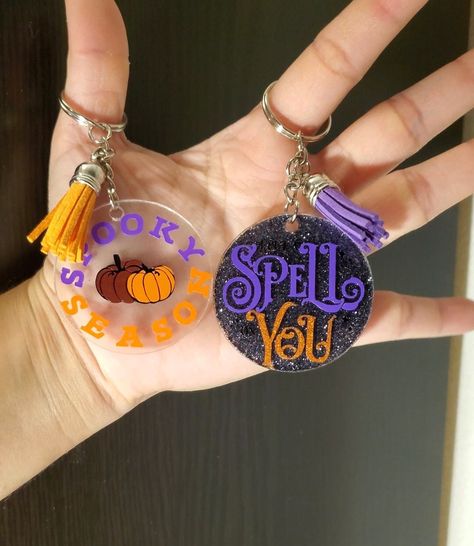 Handmade acrylic keychain  Two halloween options. One with 'I put a spell on you', and one of 'spooky season'.  Keychains have the option to have a black glittery back or just the design on the one side.  Keychains are approximately 4 inches in length and 2 inches in width. Halloween Keychains Cricut, Halloween Crafts To Sell Cricut, Halloween Keychains Diy, Cricut Keychain Ideas, Halloween Keychains, Glitter Keychains, Epoxy Keychains, Diy Crafts Keychain, Halloween Crafts To Sell