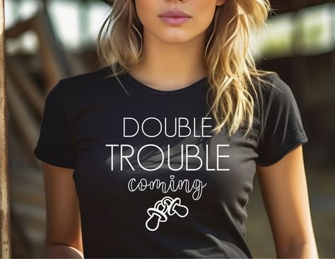 Prepare for double the joy with our adorable black pregnancy announcement t-shirt! Featuring the playful phrase "Double Trouble Coming," this shirt is perfect for announcing the arrival of your precious twins. 🌟👶👶 Made with soft, high-quality fabric, it ensures both style and comfort during your pregnancy journey. Embrace the excitement and share the wonderful news in a fun and unique way. Grab yours today and get ready for double the love and happiness! 🌈💕 Black Pregnancy, Maternity Announcement, Twins Announcement, Baby Announcement Shirts, Pregnancy Announcement Shirt, Pregnancy Journey, Love And Happiness, Pregnancy Tshirts, Pregnancy Gifts