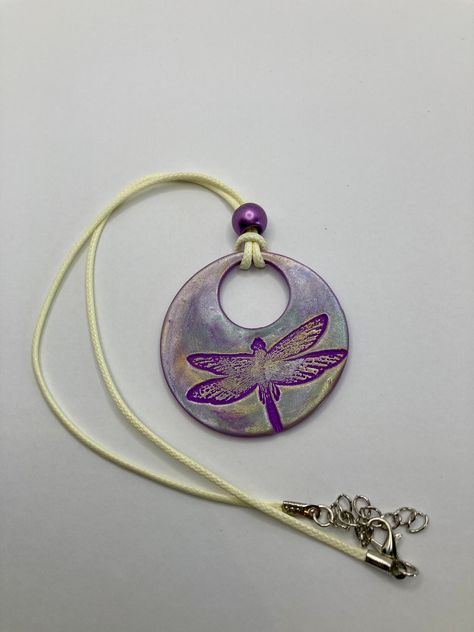 Purple Polymer Clay with Silver Mica Powder to shine. Pendant is 2 inches around. It has 16 inch waxed cotton leather cord, lobster claw clasp.  This is fully hand made and hand finished so slight variations in color/finish should be expected. Mica Powder color will shine differently in different light. Jewelry Out Of Clay, How To Make Clay Pendants, Polymer Clay Necklace Pendant Ideas, Clay Pendants Aesthetic, Silver Clay Jewelry Ideas, Clay Necklace Ideas, Clay Necklace Pendant, Purple Polymer Clay, Enameling Jewelry