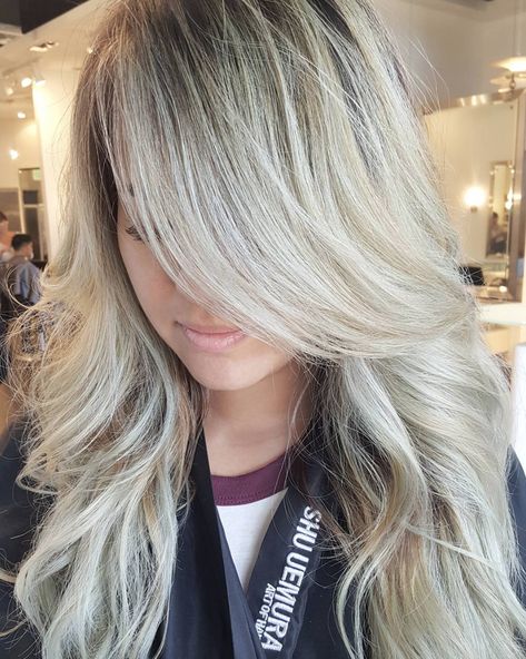 The 2017 version of beach waves? Chandelier layers. "It's perfect for long- to medium-length hair, works with all hair types, and can be easily adjusted for your face shape," says Alan Vuong, owner of Salon Blanc in Honolulu, HI. It has layers that fall freely and precisely, which adds volume that won't be weighed down or flattened. "Ask your stylist for long layers at the back and smooth, graduated layers to frame your face," suggests Vuong. "Or you can balance the layers with long bangs tha... Chandelier Layers Haircut, Long Hair With Bangs And Layers, Haircuts For Long Hair With Bangs, Haircut For Long Hair, Layers Haircut, Haircut Long, Popular Haircuts, Long Hair With Bangs, Long Layered Hair