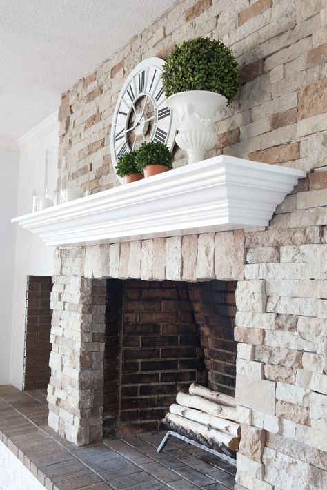 DIY fireplace and mantel makeover. Click over to see how I transformed my brick fireplace to stone and made the mantel by repurposing an old piece of furniture. Fireplace Mantel Makeover, Spring Fireplace, Diy Stone Fireplace, Airstone Fireplace, Stone Fireplace Makeover, Diy Fireplace Mantel, Red Brick Fireplaces, Diy Fireplace Makeover, Fireplace Update